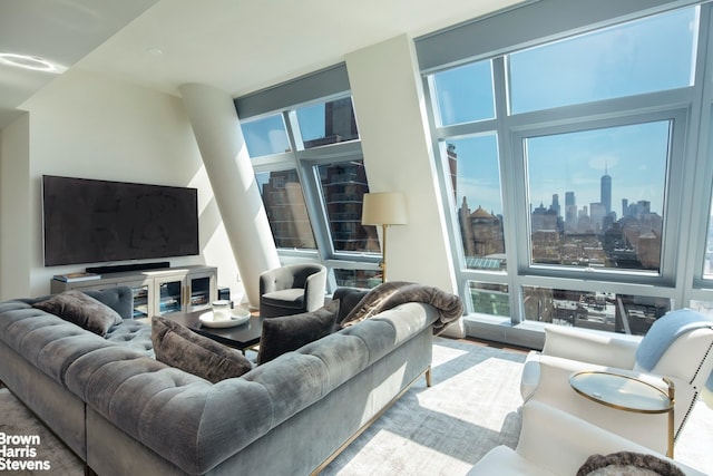 living room with a city view and wood finished floors