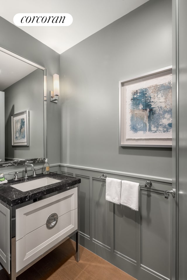 100 Claremont Ave Unit 36B, New York City, NY 10027 - bathroom featuring a wainscoted wall, vanity, and a decorative wall