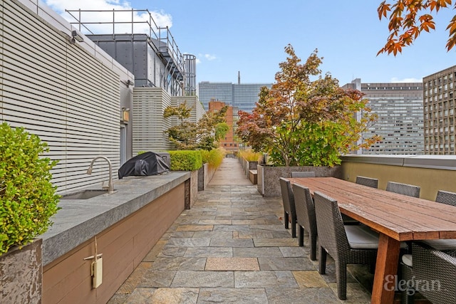 view of patio / terrace featuring sink and area for grilling