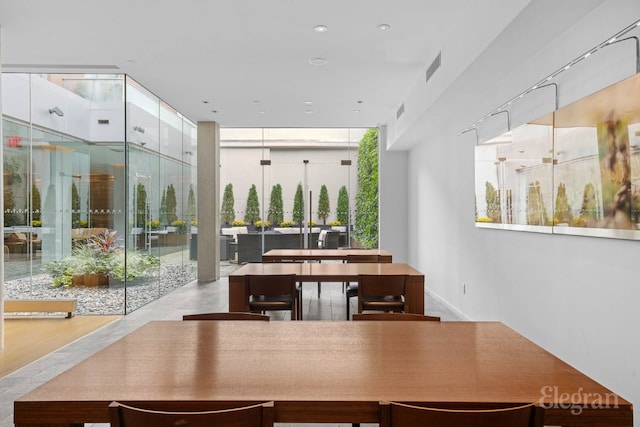 dining space featuring expansive windows