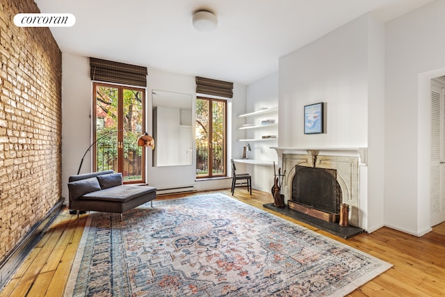 215 E 17th St Unit 3, New York City, NY 10003 - living area featuring a high end fireplace and wood-type flooring