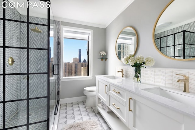 bathroom with toilet, vanity, an enclosed shower, and ornamental molding