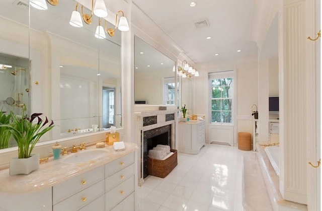 6 E 69th St, New York City, NY 10021 - full bath with tile patterned flooring, vanity, a fireplace, recessed lighting, and a tub