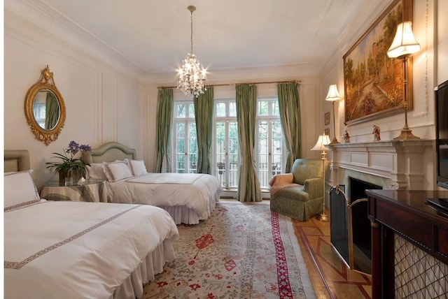 6 E 69th St, New York City, NY 10021 - bedroom with a chandelier, ornamental molding, and a fireplace