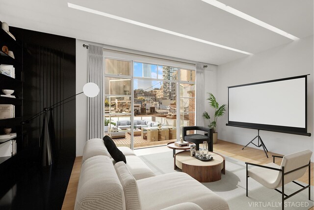 cinema room featuring wood finished floors