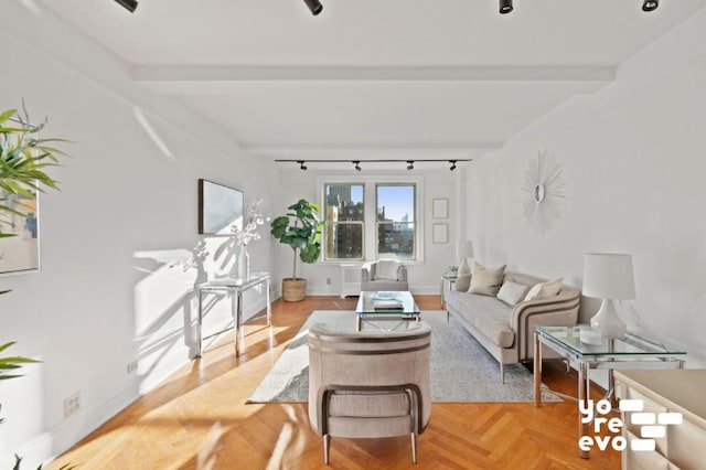 living room featuring parquet flooring and beamed ceiling