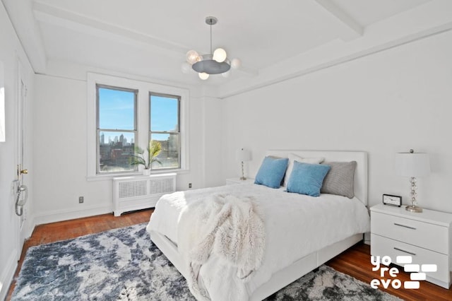 bedroom featuring dark hardwood / wood-style floors, radiator, beam ceiling, and a chandelier