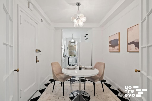 dining room featuring a chandelier