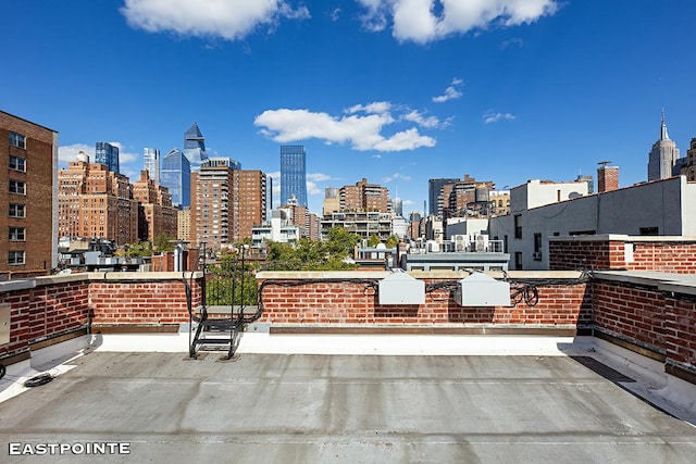 view of patio / terrace featuring a city view