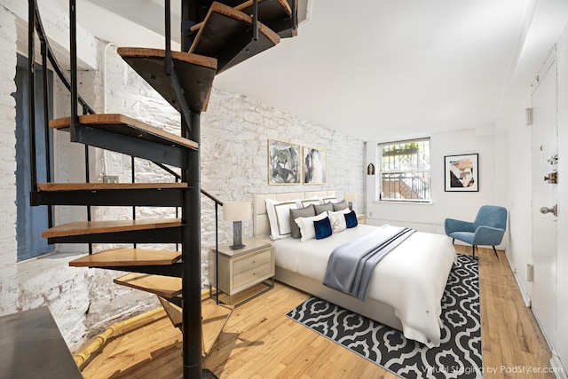 bedroom featuring wood finished floors