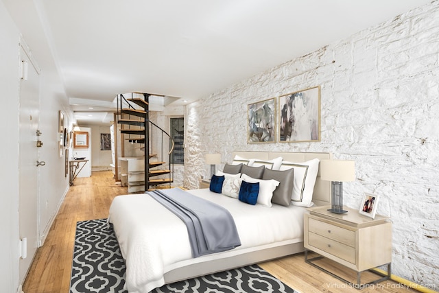 bedroom with light wood-type flooring