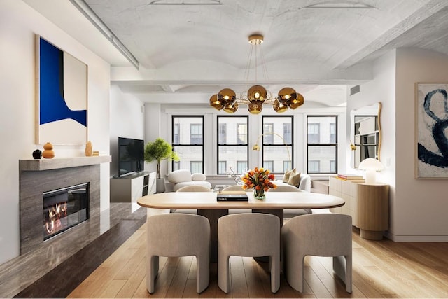 dining area with light hardwood / wood-style floors