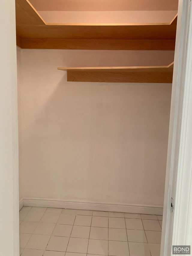 spacious closet featuring light tile patterned floors