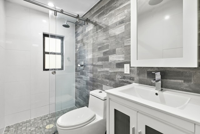 1241 Herkimer St, New York City, NY 11233 - bathroom featuring tile walls, a shower stall, vanity, and backsplash