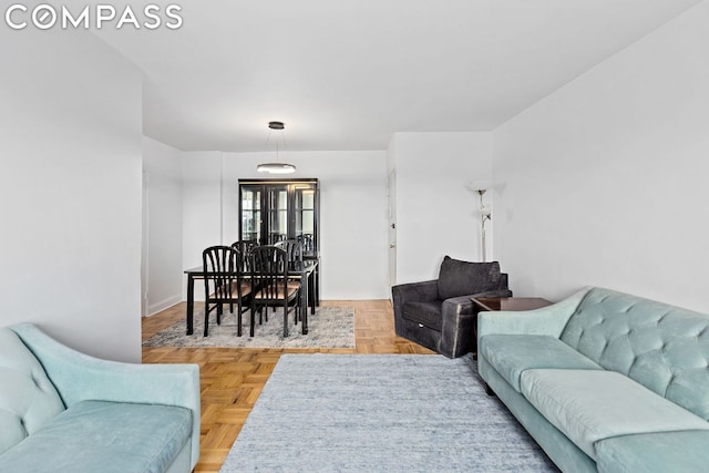 living room featuring parquet flooring