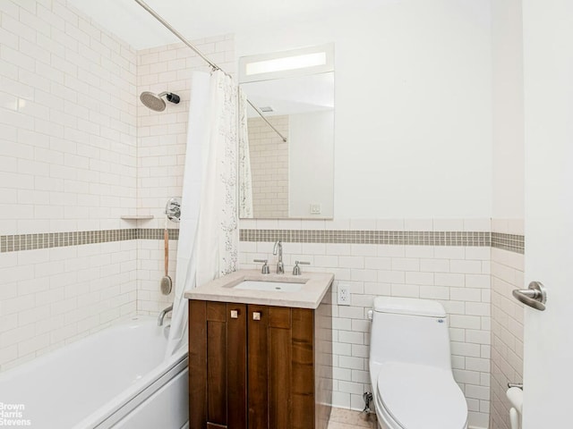 bathroom with shower / bath combo, toilet, tile walls, and vanity