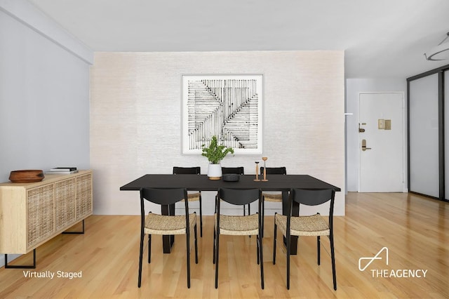 dining room with light wood-type flooring