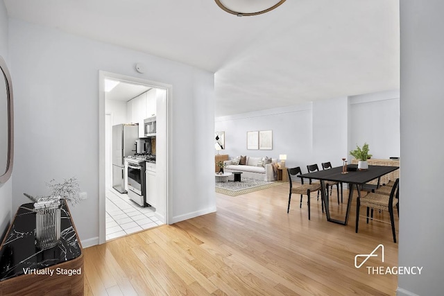 dining space featuring light hardwood / wood-style floors