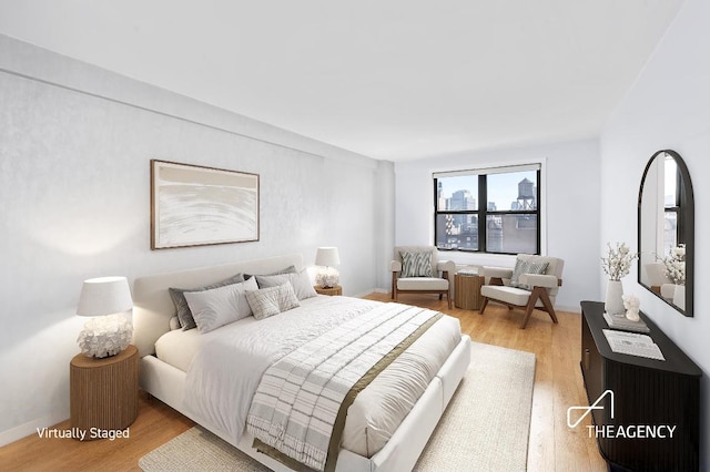 bedroom with light hardwood / wood-style floors