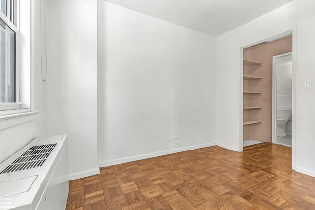 empty room featuring baseboards