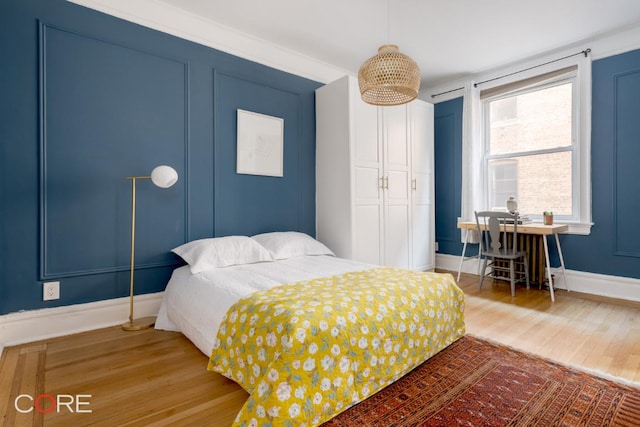 bedroom with hardwood / wood-style flooring