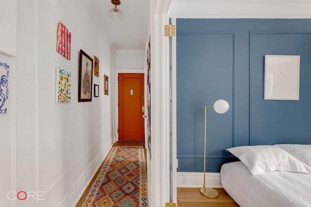 corridor featuring hardwood / wood-style floors