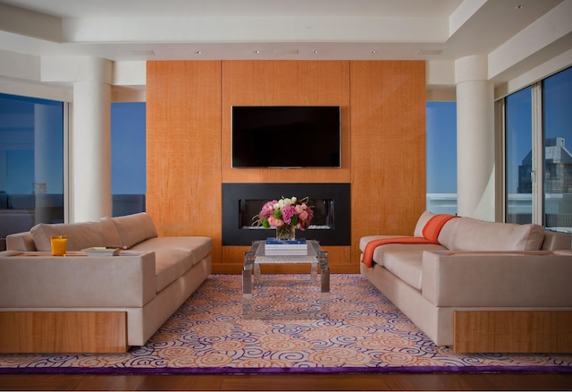 living room with wood finished floors and a fireplace