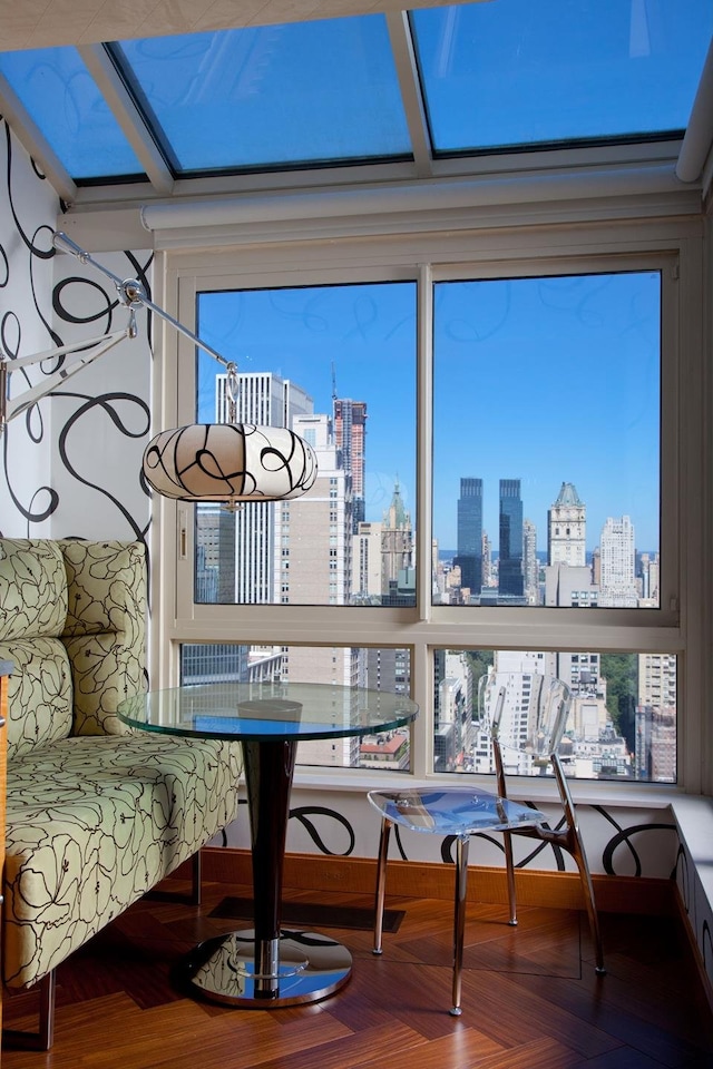 sunroom / solarium featuring a view of city