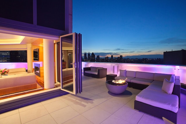 view of patio / terrace featuring an outdoor living space with a fire pit