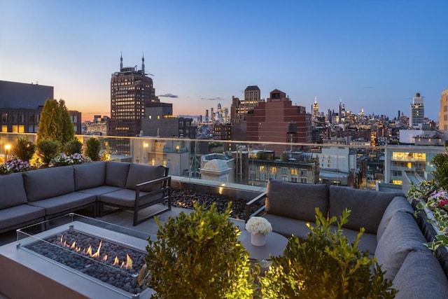 exterior space featuring an outdoor living space with a fire pit