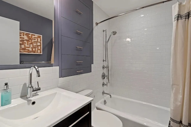 full bathroom featuring vanity, decorative backsplash, tile walls, toilet, and shower / bath combo with shower curtain