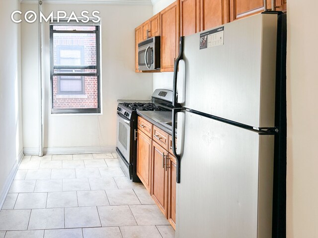 kitchen featuring crown molding and appliances with stainless steel finishes