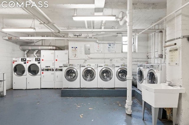 laundry room featuring washing machine and clothes dryer