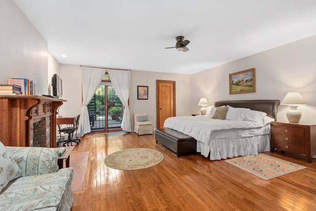 bedroom featuring ceiling fan, light hardwood / wood-style flooring, and access to outside