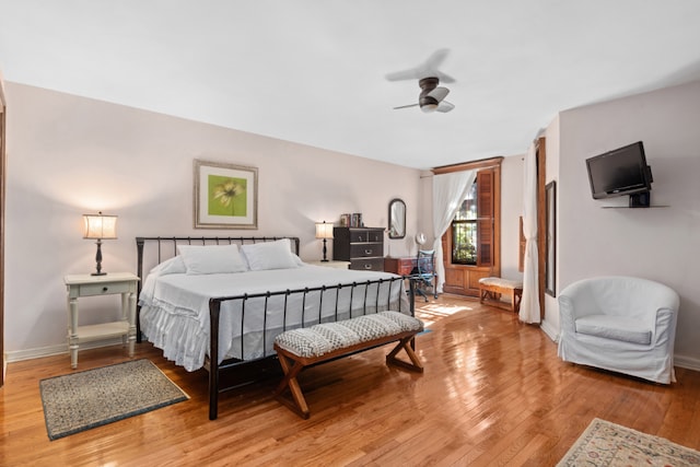 bedroom featuring ceiling fan and hardwood / wood-style floors