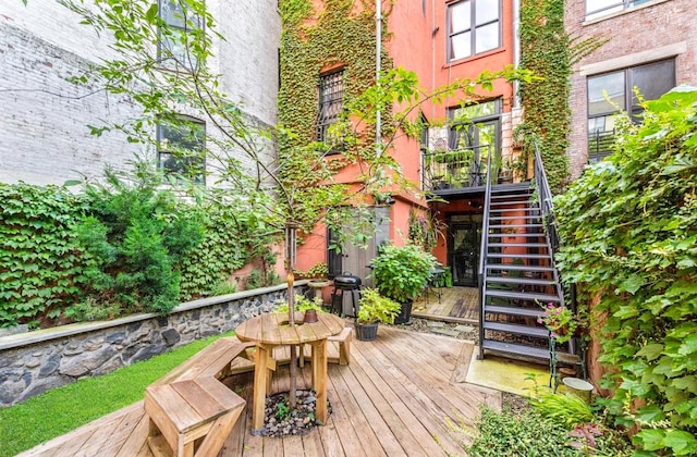 wooden deck featuring a grill