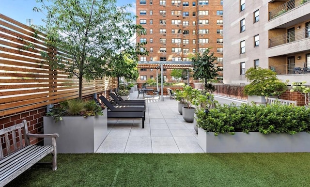 view of community with a patio and a pergola