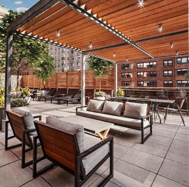 view of patio with outdoor lounge area and a pergola