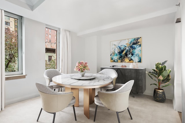 188 E 78th St Unit 4D, New York City, NY 10075 - dining space featuring baseboards and light carpet