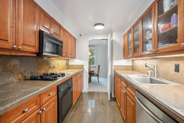 188 E 78th St Unit 4D, New York City, NY 10075 - kitchen with black appliances, a sink, granite floors, baseboards, and brown cabinetry