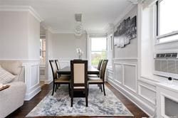 dining area with cooling unit, dark wood-type flooring, and ornamental molding