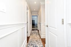 hallway featuring ornamental molding