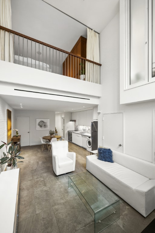 living room with a high ceiling