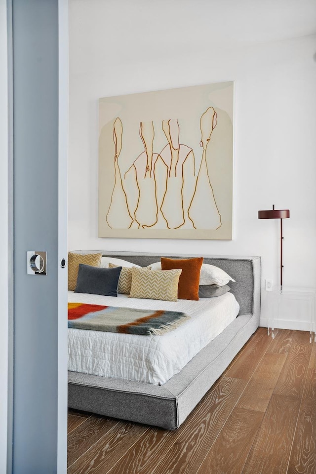 bedroom with wood finished floors