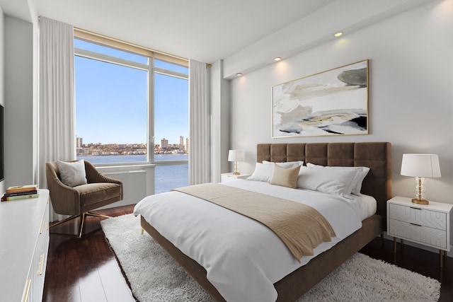 100 Riverside Blvd Unit 14-N, New York City, NY 10069 - bedroom with wood finished floors, a water view, a city view, and recessed lighting