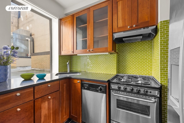 kitchen with tasteful backsplash, sink, and stainless steel appliances