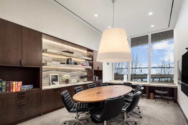 dining space with light carpet and recessed lighting