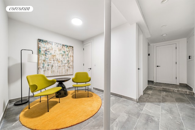 sitting room with baseboards and visible vents