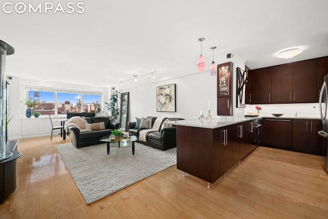 living area featuring light wood-style flooring