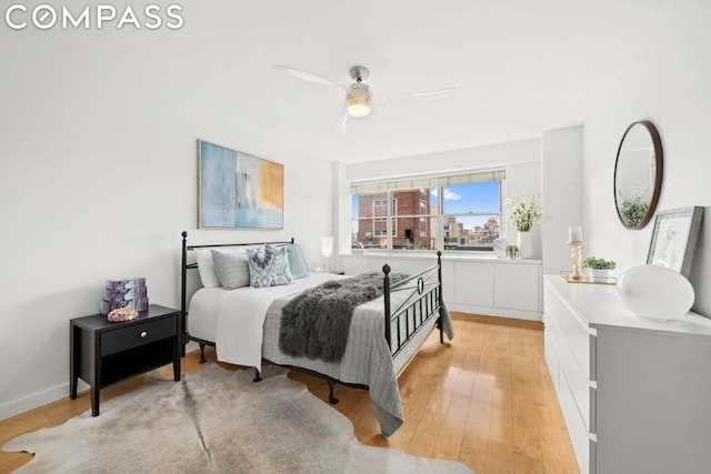 bedroom featuring light wood-style floors and ceiling fan